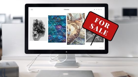 Image contains a website with a "For Sale" sign on it.