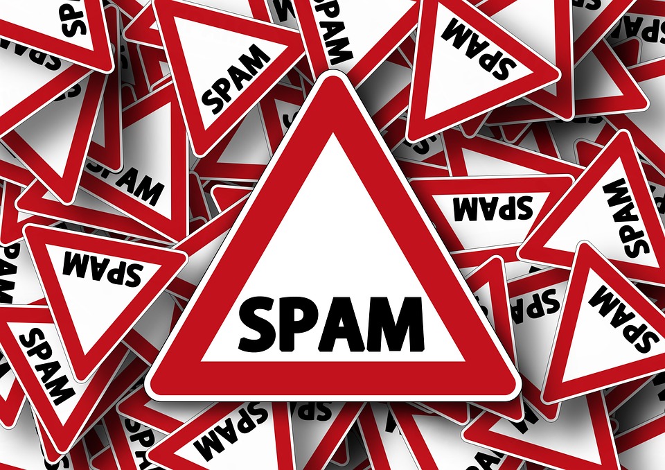 spam-warning-signs Image contains warning signs that say 'spam'.